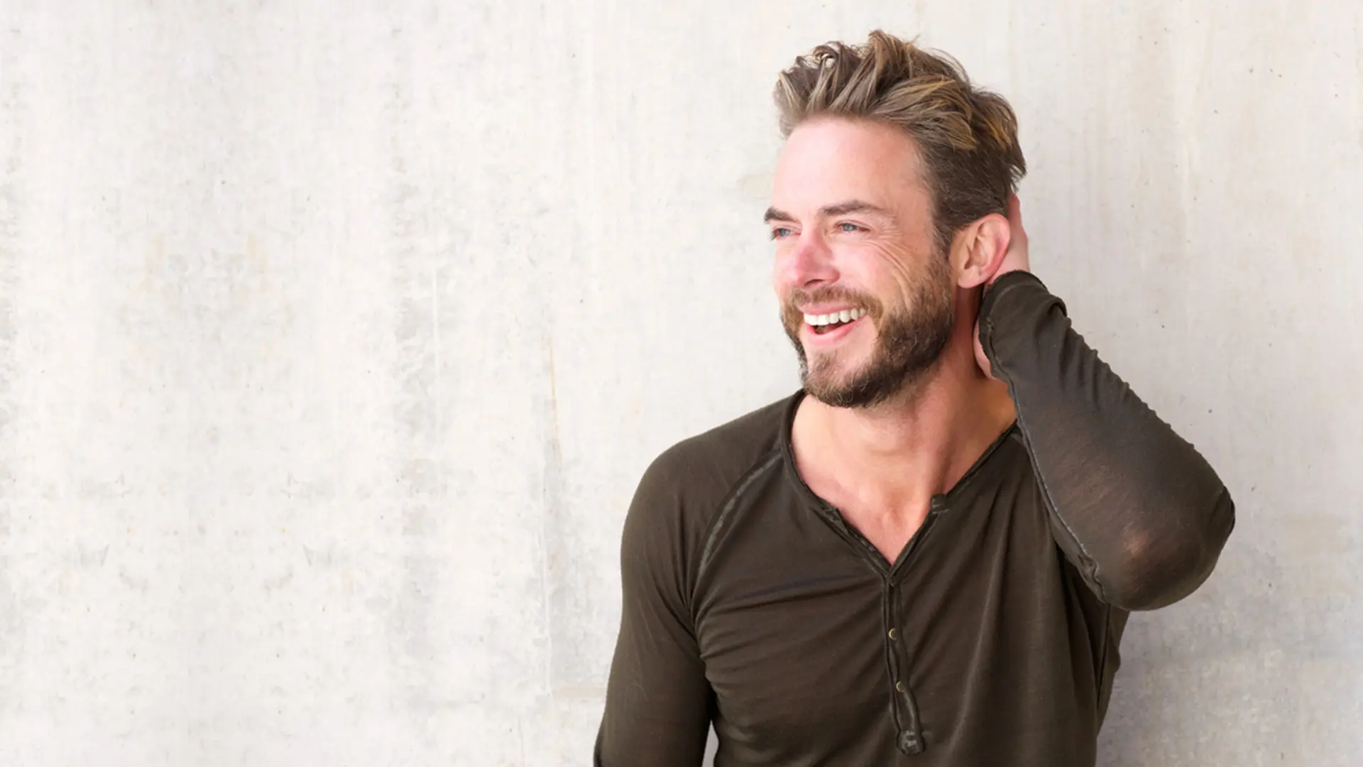 Man Smiling Showing Off Dental Crowns