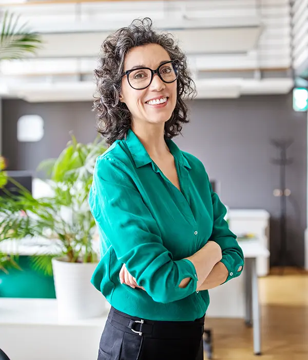 Middle Aged Woman In Office Smiling